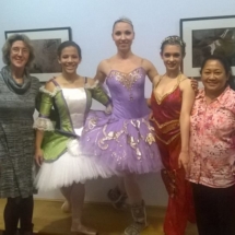 Girls and Ms. Valeria pose at the Nutcracker performance